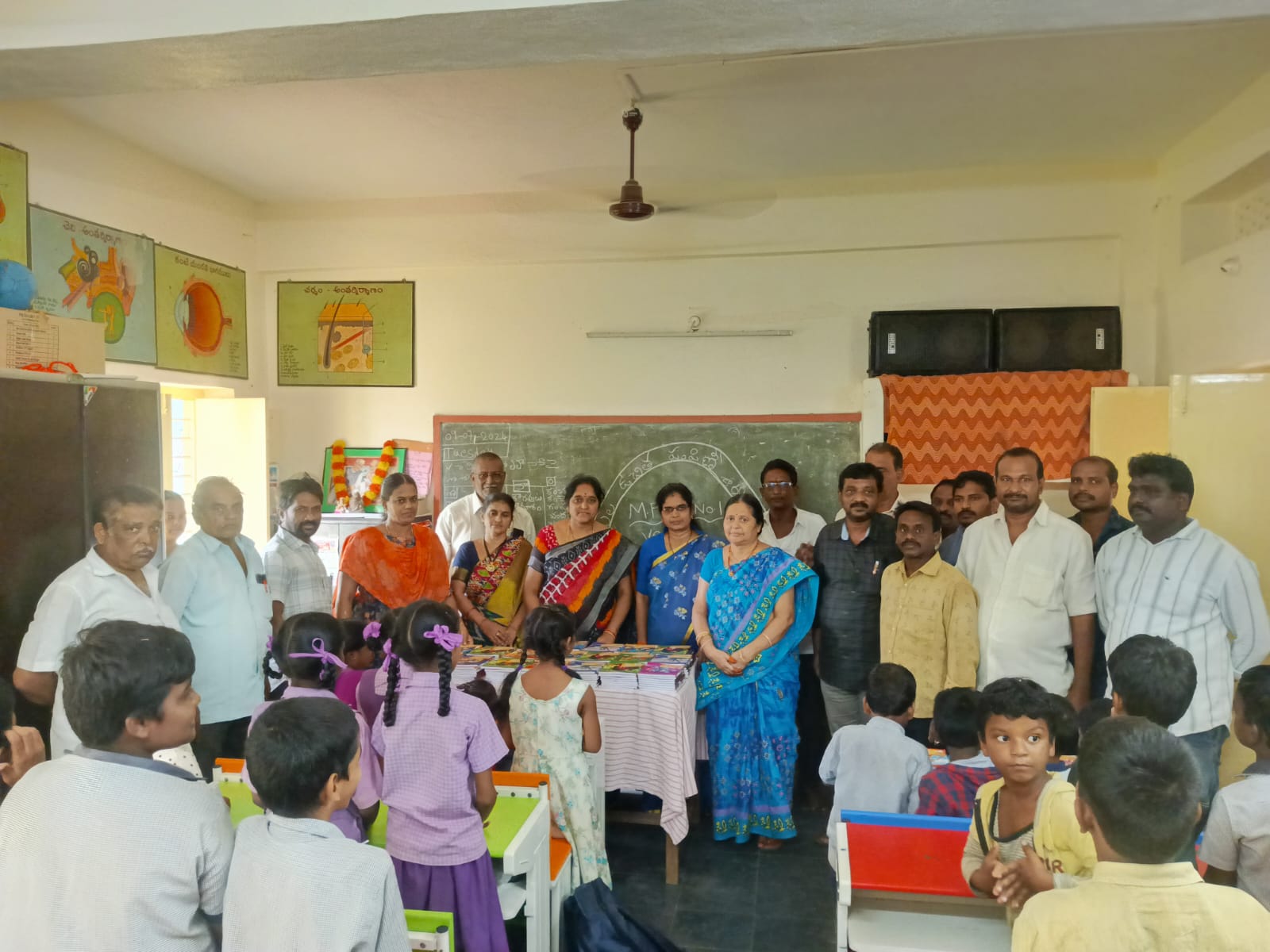 Students receiving books